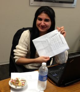 Farah posing with the lunch menu part of the work agenda
